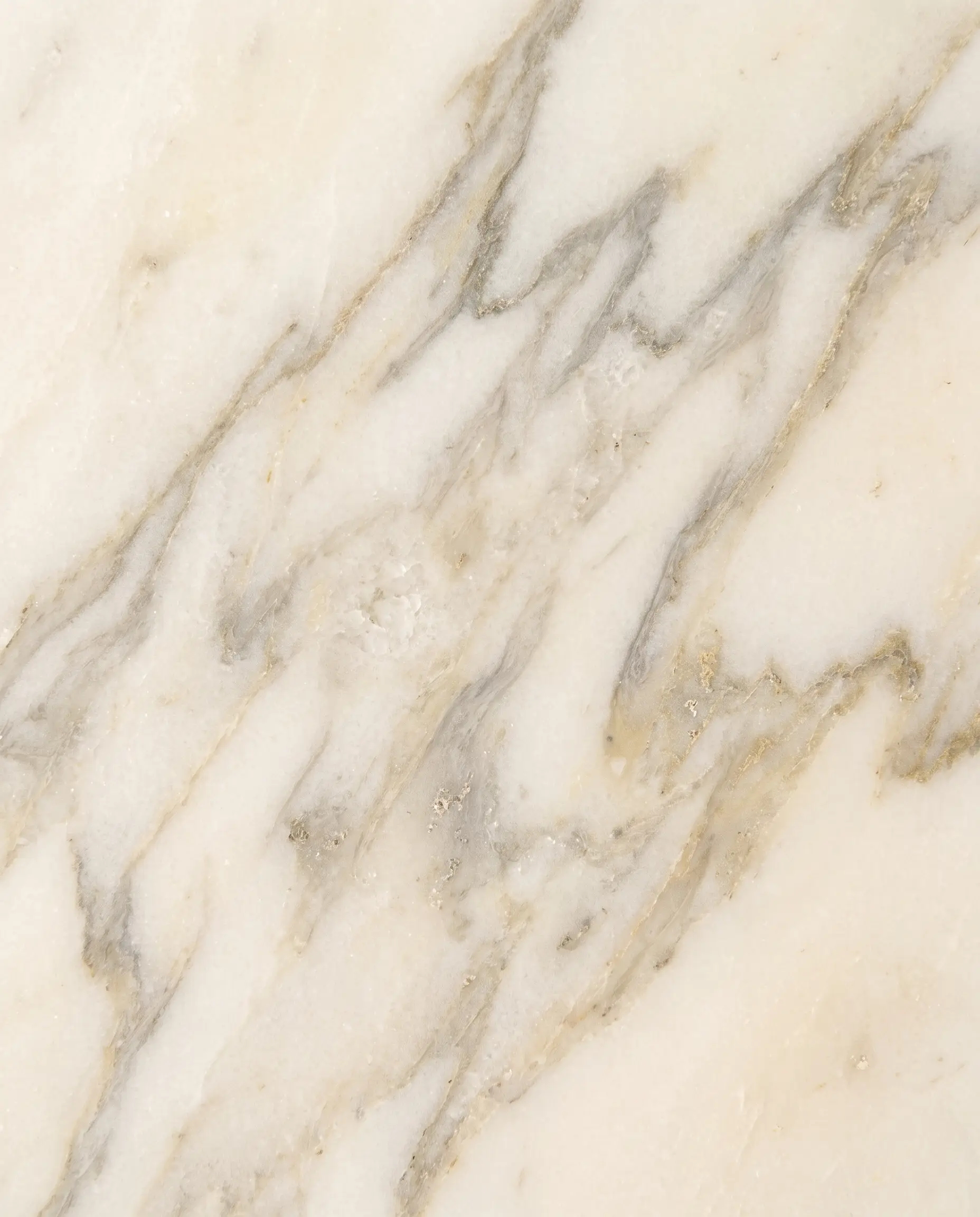 Honed Calacatta — Soft grey and gold veining, honed to the touch